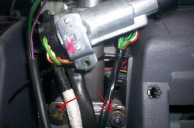 remove two bolts to drop the steering column