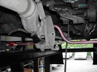 take off link bracket to clear exhaust