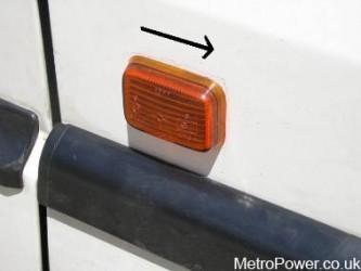 remove old side repeater by pushing in direction of the arrow