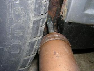 grease gun connected to grease nipple on metro